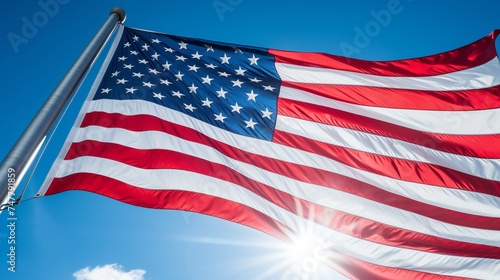 A panoramic view of the American flag waving proudly against a clear blue sky.