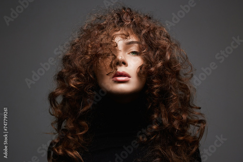 beautiful young woman with curly hair. healthy hair girl