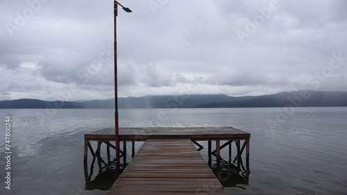 wooden pier on Lake Matano, Sorowako, South Sulawesi. Indonesia photo
