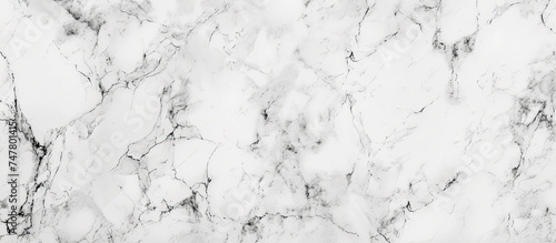 A detailed view of a white marble texture, showcasing its natural patterns and exquisite design. The texture appears smooth and elegant, with intricate details visible up close.