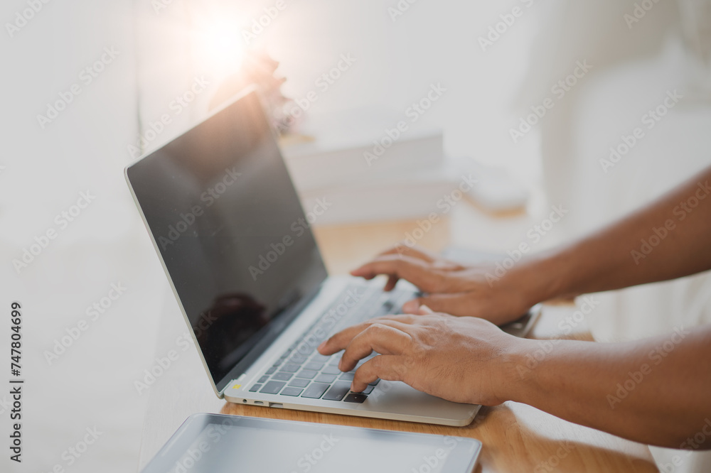 Fototapeta premium Close Up man using laptop online shopping with laptop, Online payment at home or office, internet banking, young people future lifestyle ideas for spending in ordering products