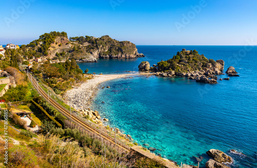 Fototapeta Naklejka Na Ścianę i Meble -  Panoramic view of Capo Taormina cape with Isola Bella island on Ionian sea shore in Messina region of Sicily in Italy