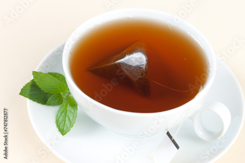 Steaming hot tea with a single tea bag