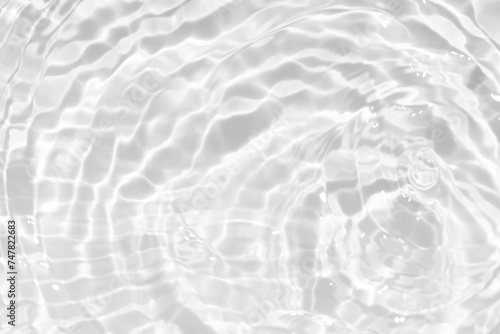 White water surface texture with ripples  splashes  and bubbles. Abstract summer banner background Water waves in sunlight with copy space cosmetic moisturizer micellar toner emulsion. White water.