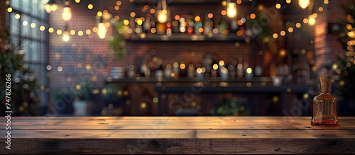 A wooden table is shown with a bottle of liquor placed on top of it. The background features a bokeh effect, creating an abstract blur in a creative loft bar setting. photo