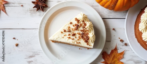 A single slice of cheesecake with cream frosting sits elegantly on a white plate, resting on a white wooden table. The rich dessert appears delicious and tempting.