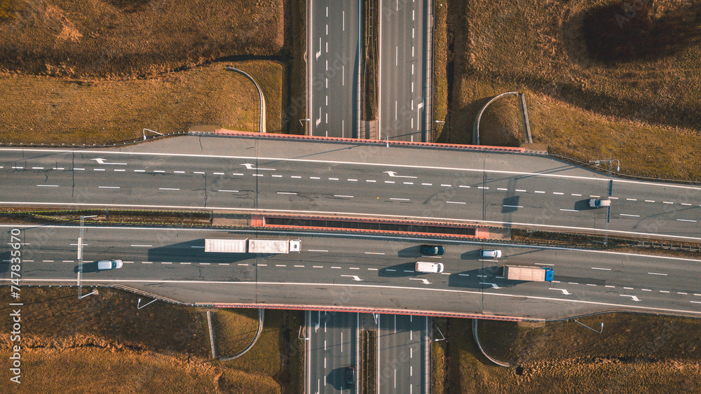road infrastructure with a bridge and connecting two roads - a motorway ...