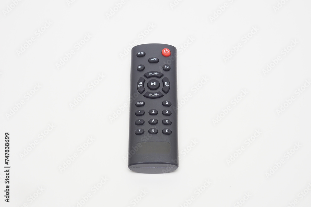 a black remote music player flat lay on a white background a black remote music player flat lay on a white background