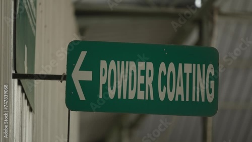 powder coating room in the manufacturing plant. powder coating marks at the factory. powder coating room sign photo