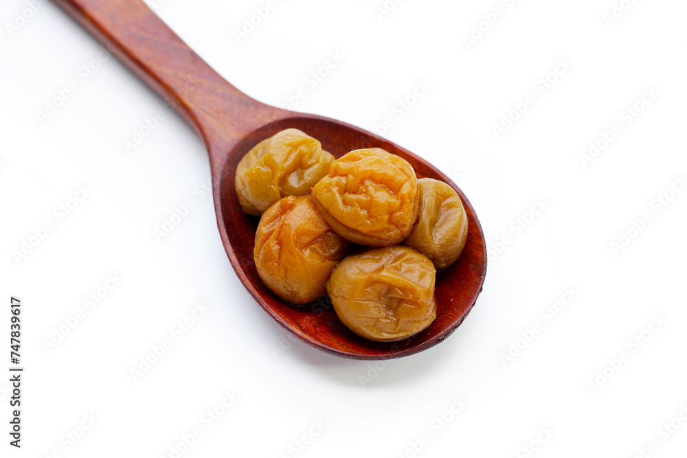 Pickled plums on white background.