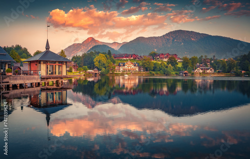 Colorful summer sunrise on Grundlsee lake. Calm morning scene of Grundlsee village, Liezen District of Styria, Austria, Europe. Beauty of countryside concept background.