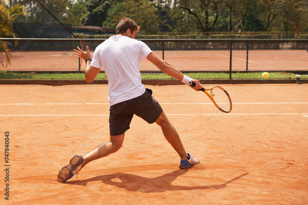 Man, playing or competition on tennis court, athlete or serve racket or ball for professional match. Fitness, outdoor or person in training for tournament and skill of strong champion player in game