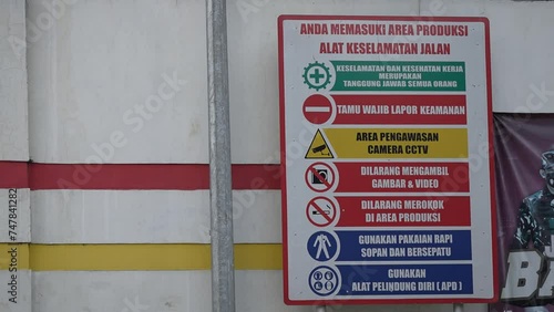 Warning banners on the side of the road. occupational health and safety signs in the factory