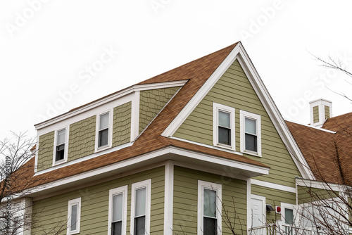 Exterior view of a newly built family house with shed dormer windows on a winter day in Brighton, MA, USA photo