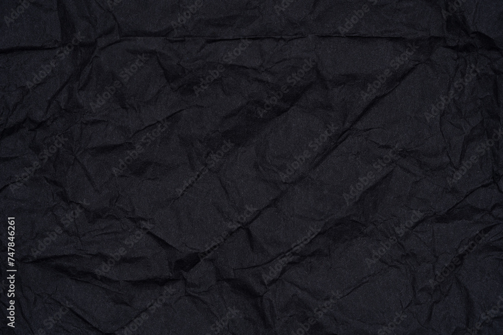 Crumpled Black Paper Textured Background. Crumpled Black Paper Textured Background.