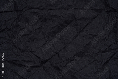 Crumpled Black Paper Textured Background.