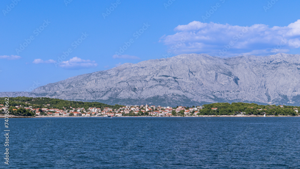 Impressive mountain view in Croatia to the town of Sumartin from the sea, Brac island, Croatia