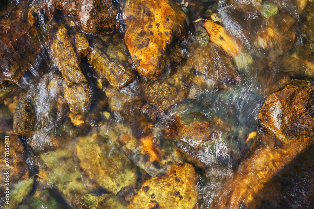 Natural background, the stones at the bottom of the creek. Clean stream. Natural background, the stones at the bottom of the creek. Clean stream.