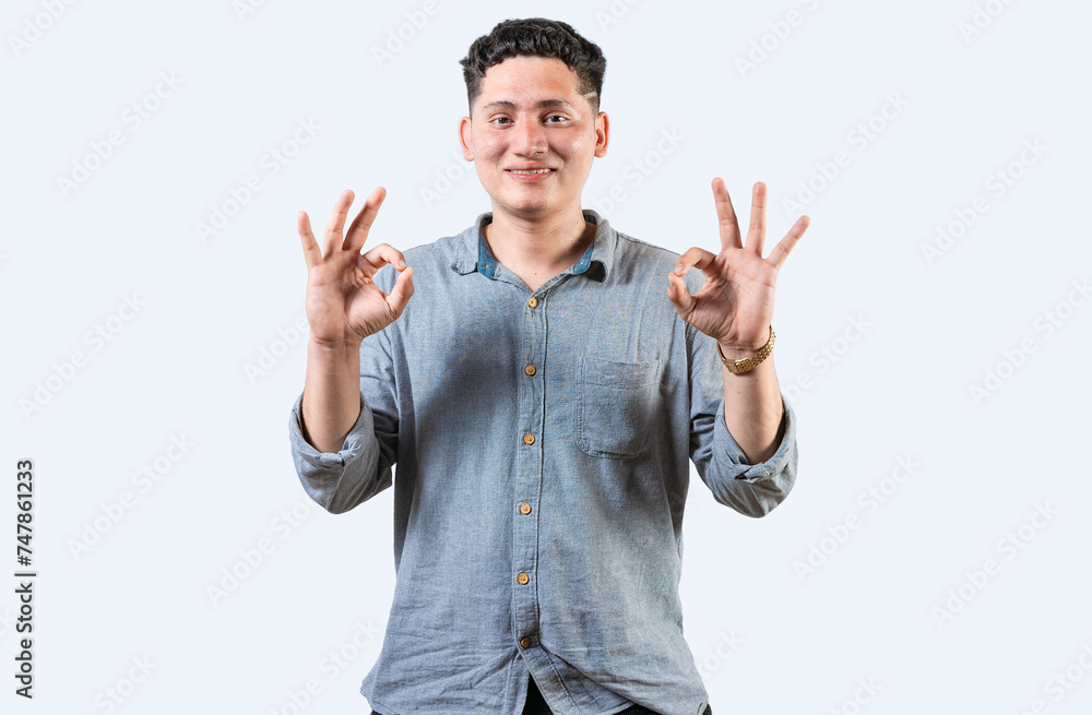 Interpreter person gesturing OK in sign language. Smiling young man gesturing APPROVED in sign language Interpreter person gesturing OK in sign language. Smiling young man gesturing APPROVED in sign language
