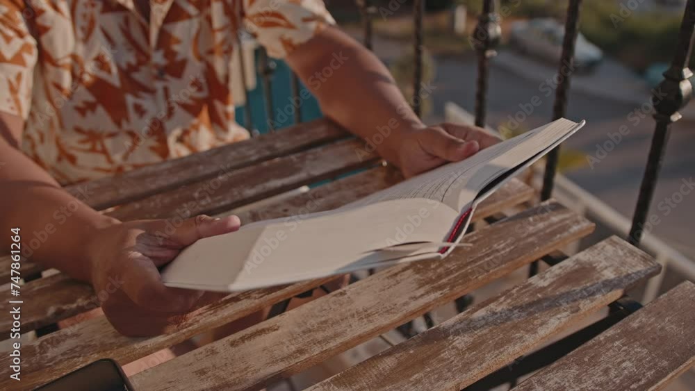 Close-up of a book in the hands of a man. Close-up of a book in the hands of a man.