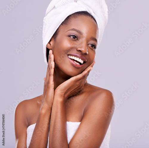 Hands, face and black woman with natural beauty, cosmetics and spa treatment isolated on purple background. Skincare glow, dermatology and self care with happy African model touching skin in studio