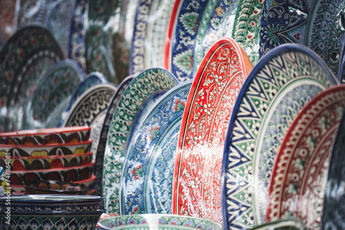 Multi-colored ceramic products with oriental ornaments at the Siab Bazaar in the ancient city of Samarkand in Uzbekistan, Siyob bozor photo