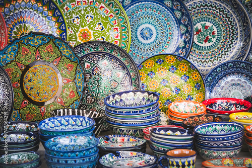 Multi-colored ceramic products with oriental ornaments at the Siab Bazaar in the ancient city of Samarkand in Uzbekistan  Siyob bozor