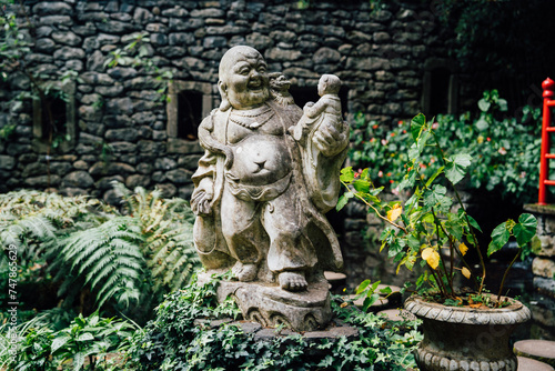 Buddhist sculpture. Botanical garden - Monte palace on spring day. Oriental part of the garden. Madeira island © Pavel Kašák