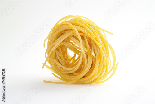 A nest of raw spaghetti strands on a pure white background