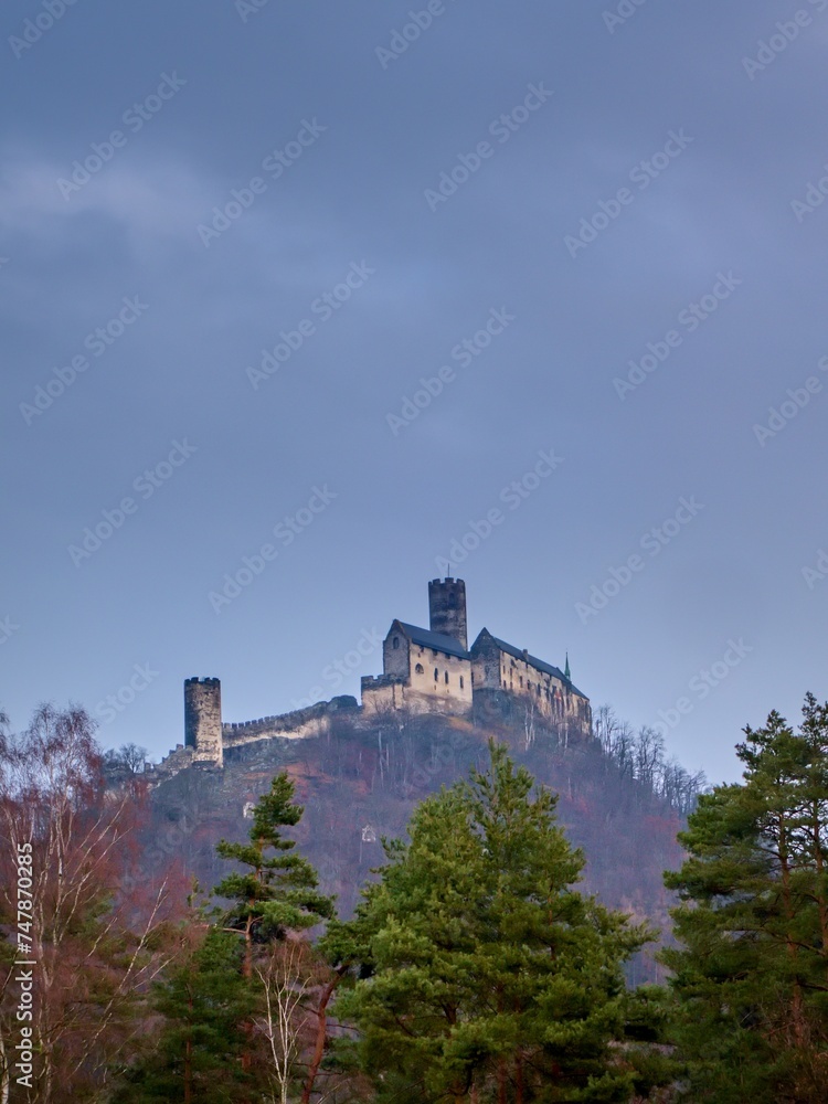 View of the medieval Czech castle (Bezdez) against a cloudy sky.