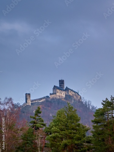 View of the medieval Czech castle  Bezdez  against a cloudy sky.