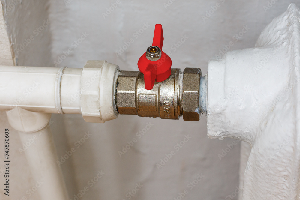 © Boris - Ball valve with red handle when closed. Shut-off valves for the heating system of the apartment. Turn off the faucet. © Boris - Ball valve with red handle when closed. Shut-off valves for the heating system of the apartment. Turn off the faucet.