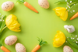 Festive Easter arrangement. Top view photo showcasing eggs, carrots for the bunny, gypsophila, and tulips on a green background, with a blank area for text or promotion