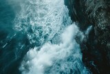 A powerful body of water crashes against a towering rocky cliff, creating an awe-inspiring spectacle, Waves breaking against an ocean cliff, causing a spray, AI Generated