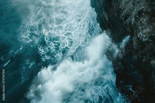 A powerful body of water crashes against a towering rocky cliff, creating an awe-inspiring spectacle, Waves breaking against an ocean cliff, causing a spray, AI Generated
