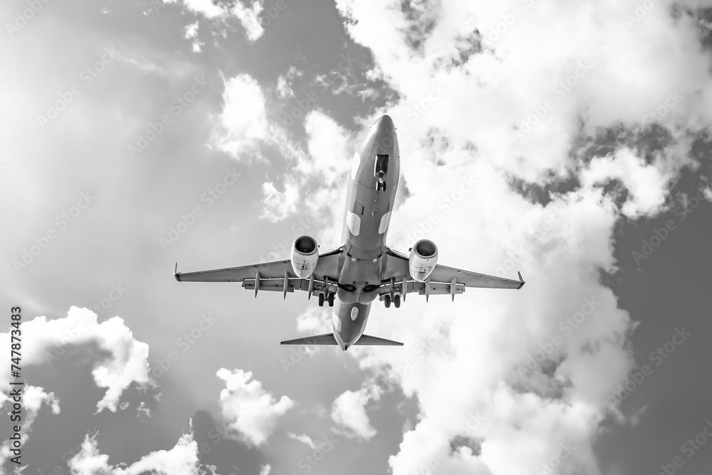 black and white photo: plane in the sky black and white photo: plane in the sky