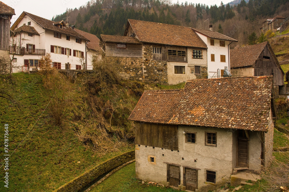 Historic stone buildings by a small stream in the mountain village of Magnanins near Rigolato in Carnia, Friuli-Venezia Giulia, north east Italy Historic stone buildings by a small stream in the mountain village of Magnanins near Rigolato in Carnia, Friuli-Venezia Giulia, north east Italy