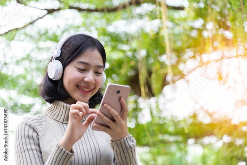 Woman relaxing listening to music with wireless headphones