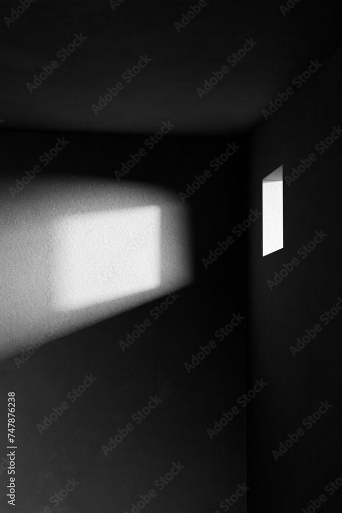 A black and white background with light coming through the building structure. A black and white background with light coming through the building structure.