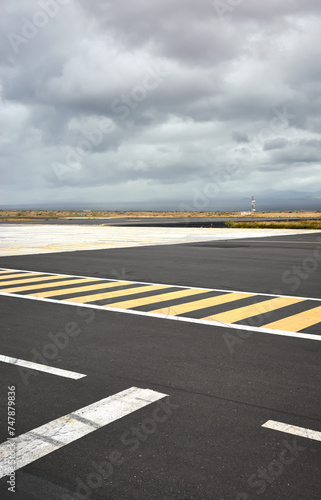 Photo of the runway on Baltra Island, selective focus, Galapagos Islands, Ecuador.