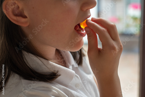 Child Girl Eating Gummy Candy