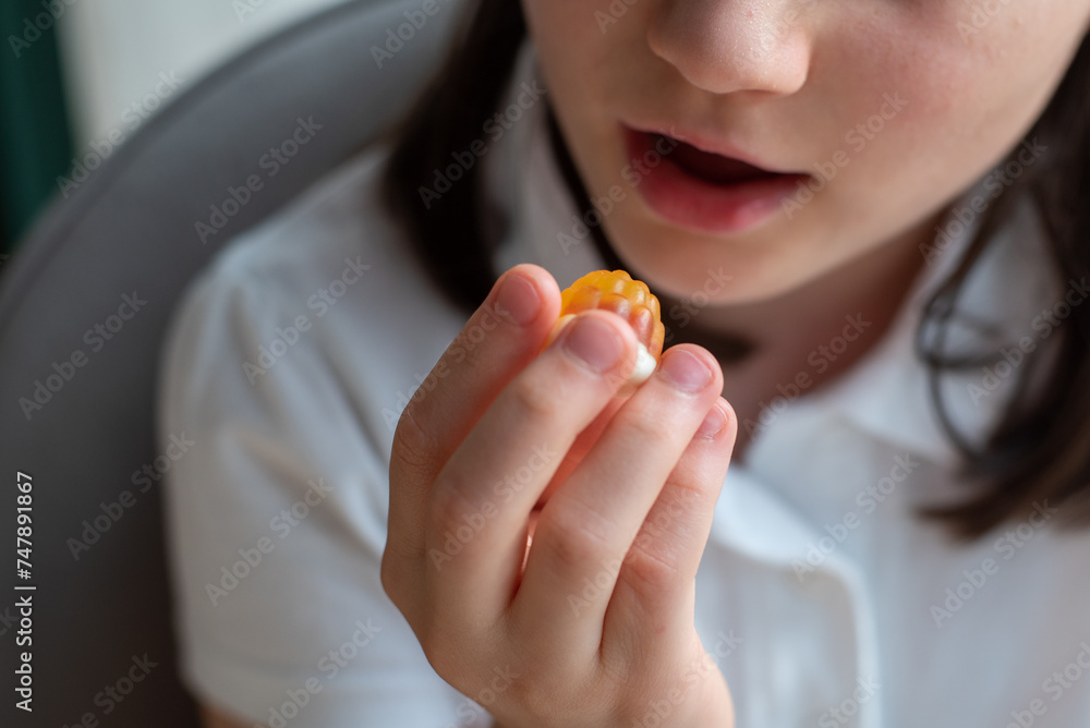 Child Girl Eating Gummy Candy