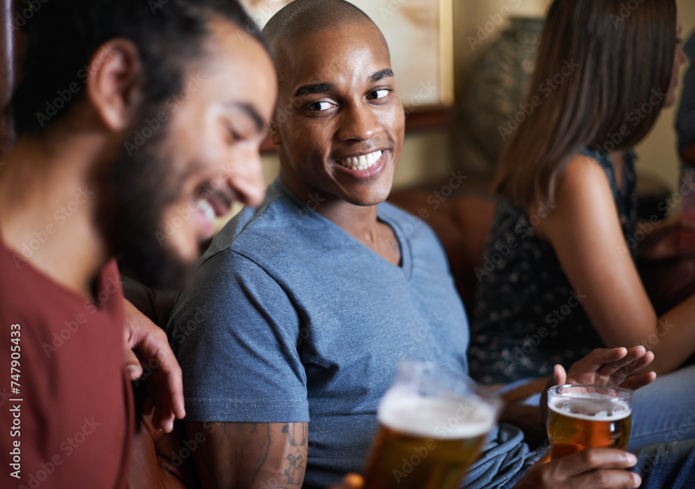 Friends, beer and happy at pub, smile and relax indoor for drink and bonding in summer to destress. Male people, pub and chill for social, guys and alcohol together and laughing for fun and weekend.