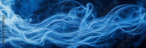 Close-up image showcasing the graceful movements of smoke tendrils against a background of vibrant  celestial blues.