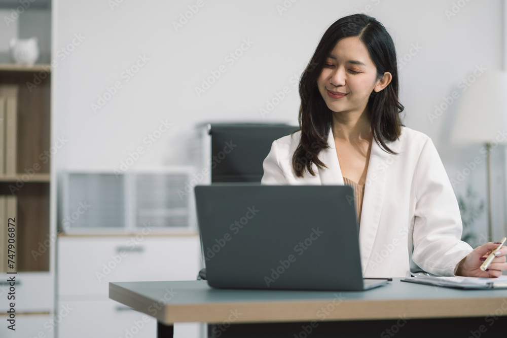 Business woman working at office with laptop and documents on desk, financial adviser analyzing data. Business woman working at office with laptop and documents on desk, financial adviser analyzing data.