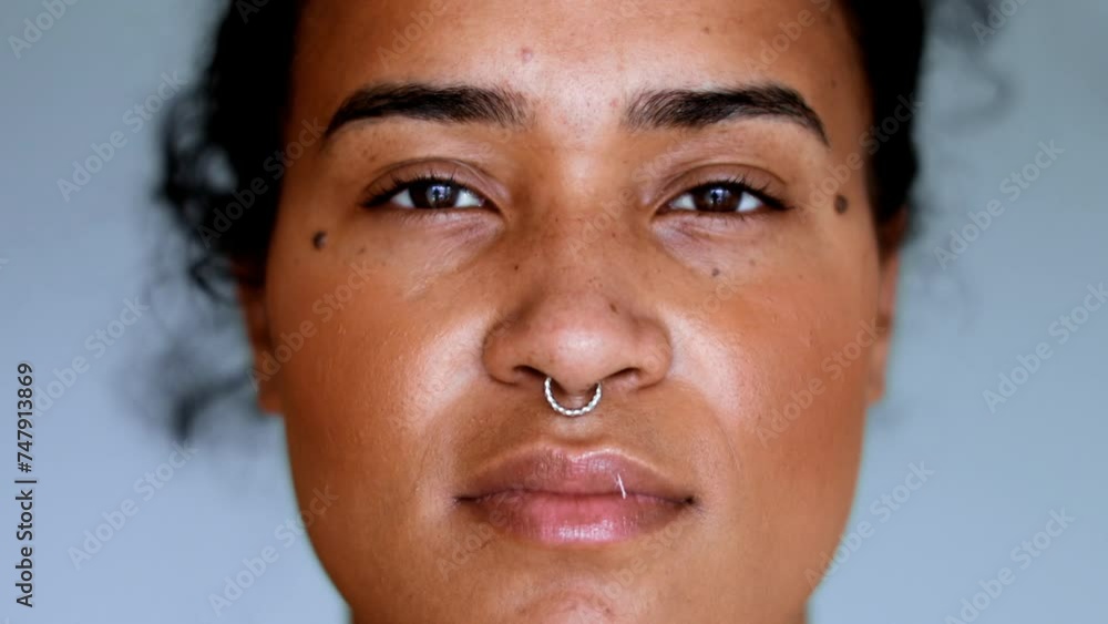 African American young woman staring at camera with Intense gaze, close-up South American black latina female 20s adult girl portrait African American young woman staring at camera with Intense gaze, close-up South American black latina female 20s adult girl portrait