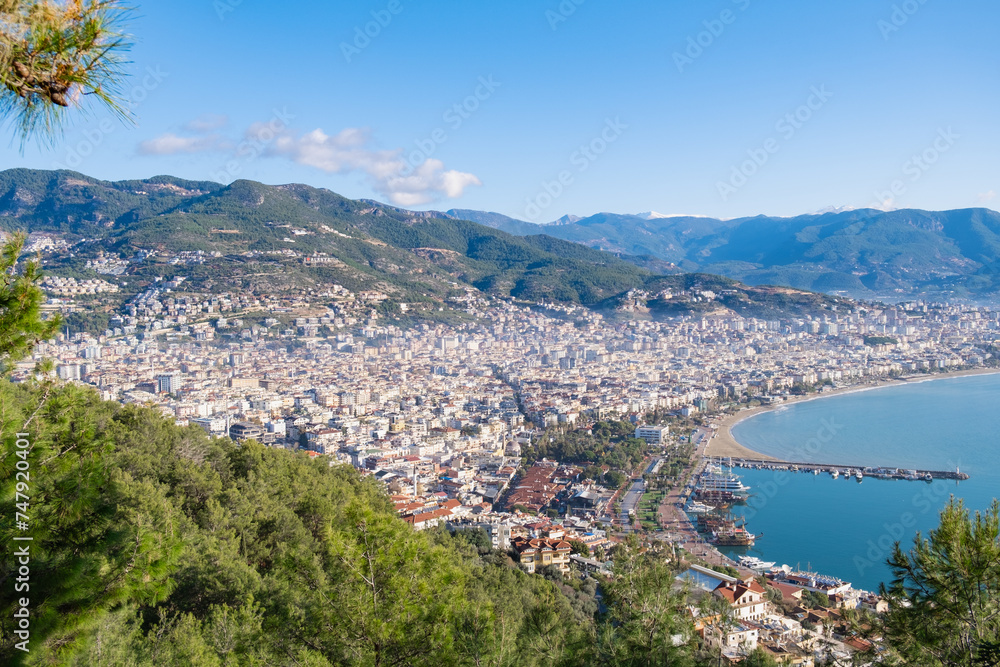 Panoramic view of the seaside town with the port. View from the mountain on a clear summer day to the resort town.