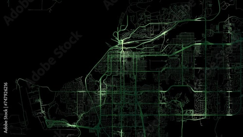 Zoom in road map of Anchorage Alaska with green glowing roads on a black background.