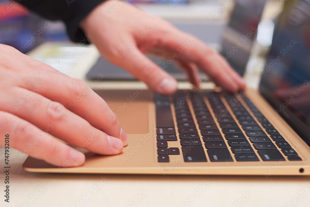Male hands on laptop keyboard Male hands on laptop keyboard