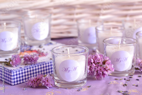 Wedding gifts favors handmade candles with bride groom custom monogram initials letters, lilac purple lavender color, original party details, vintage shabby chic romantic style photo